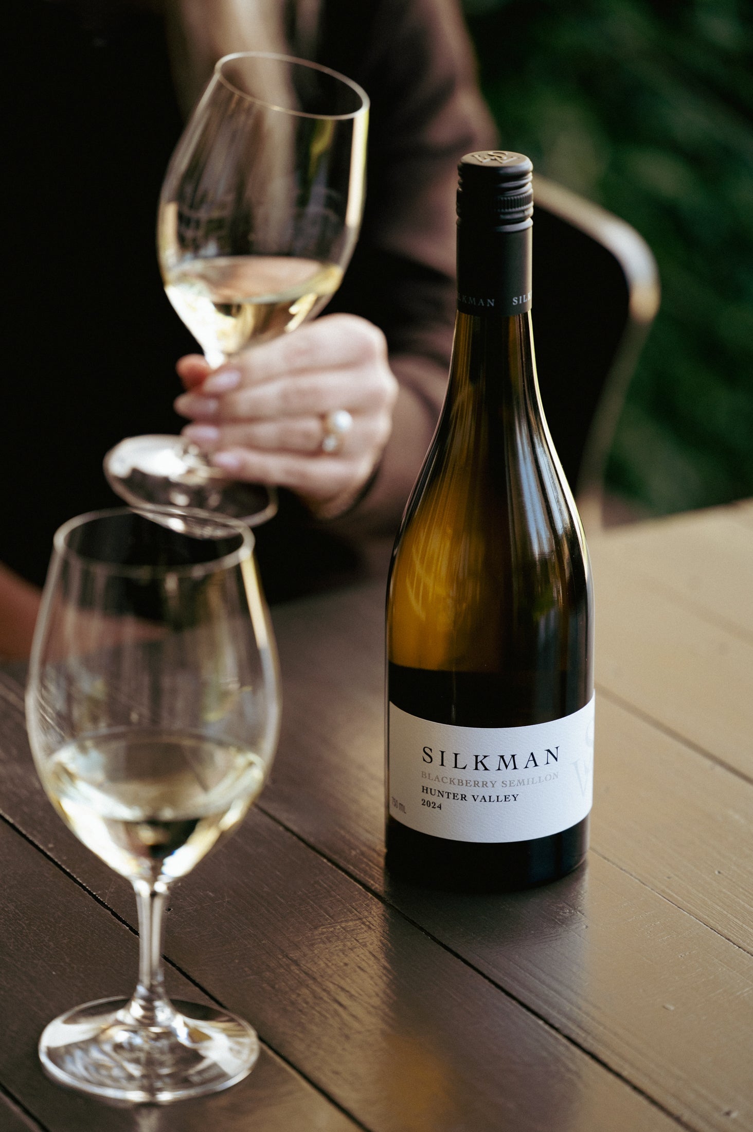 Silkman Blackberry Semillon Hunter Valley 2024 bottle with two glasses of white wine