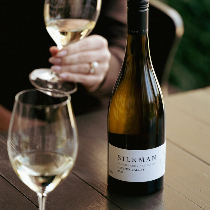 Silkman Blackberry Semillon Hunter Valley 2024 bottle with two glasses of white wine